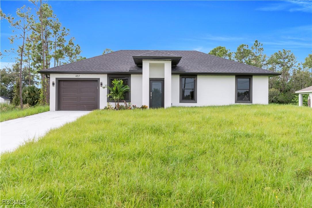 457 Woodman Dr., Lehigh Acres, FL 33972