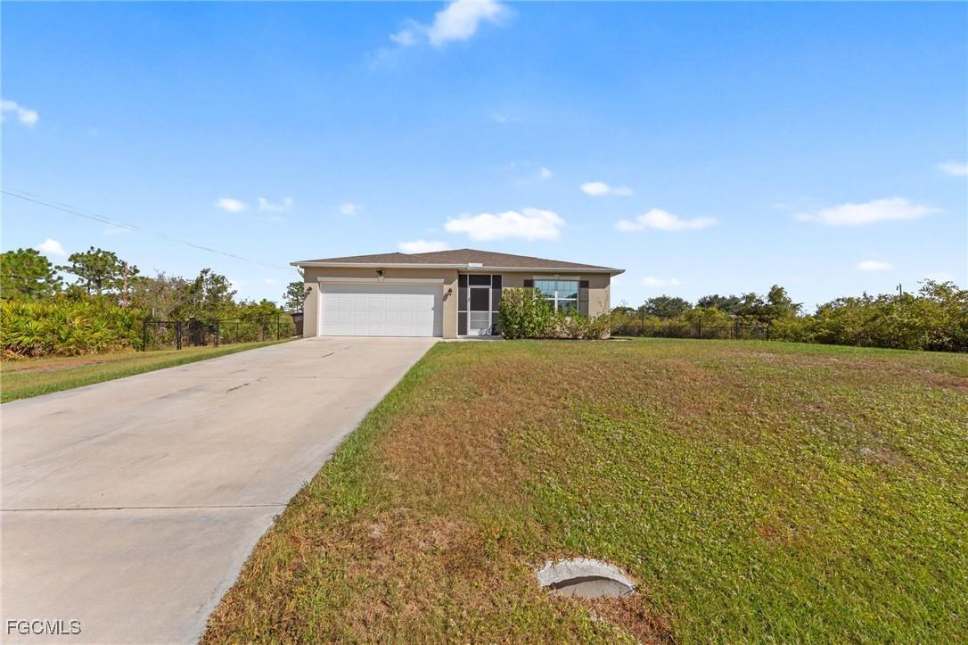 1306 Plumosa Ave., Lehigh Acres, FL 33972