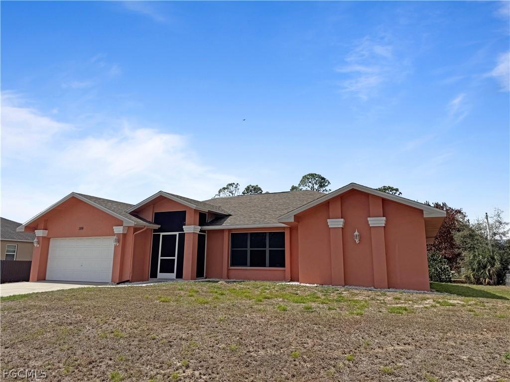 209 Mcarthur Ave., Lehigh Acres, FL 33936