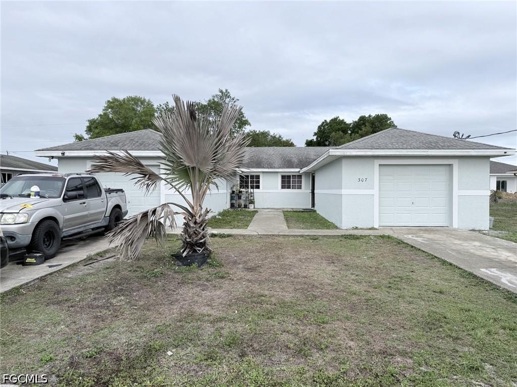 305-307 Harry Ave., Lehigh Acres, FL 33973