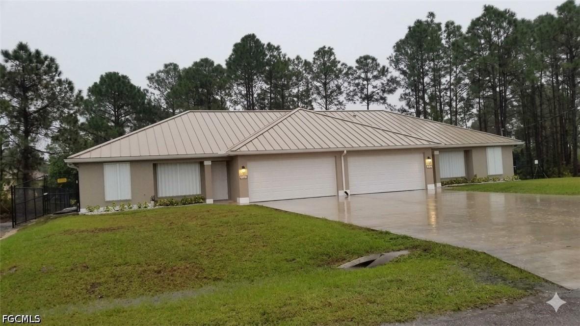 385/387 Carrillon Ave., Lehigh Acres, FL 33974