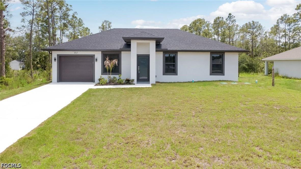 457 Woodman Dr., Lehigh Acres, FL 33972