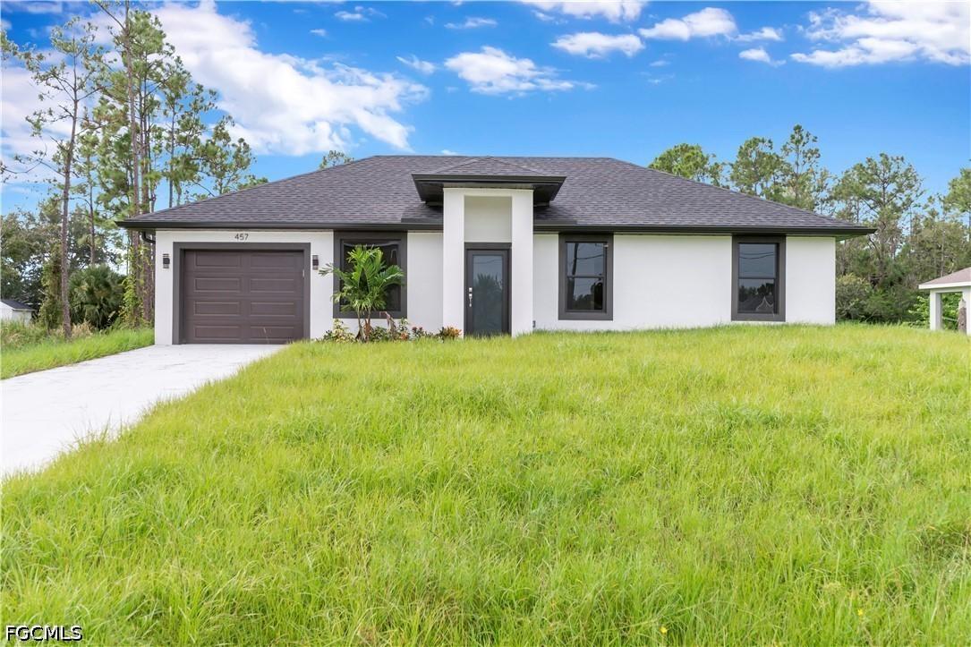 457 Woodman Dr., Lehigh Acres, FL 33972