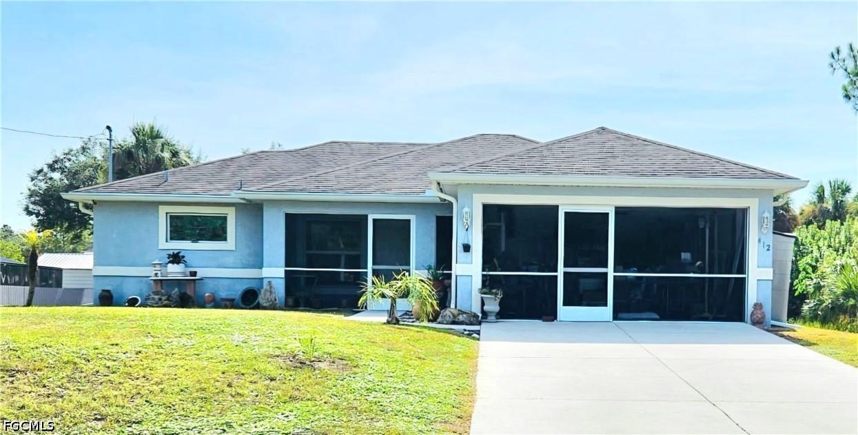 412 Cortez Ave., Lehigh Acres, FL 33972
