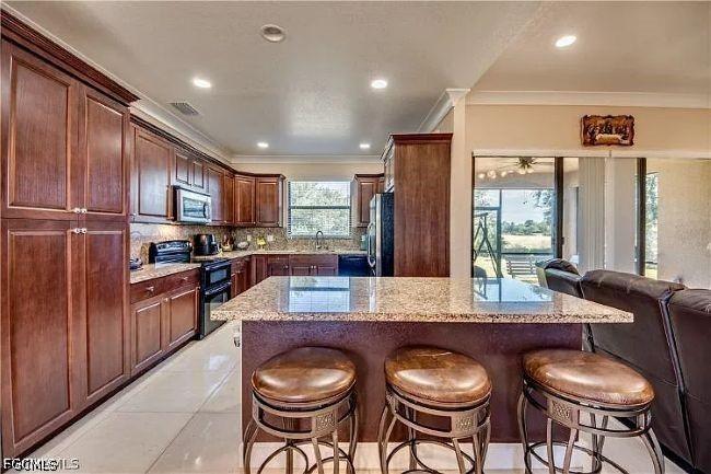 906 Sunniland Blvd., Lehigh Acres, FL 33971