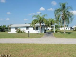 213 Canal Ct., Lehigh Acres, FL 33936