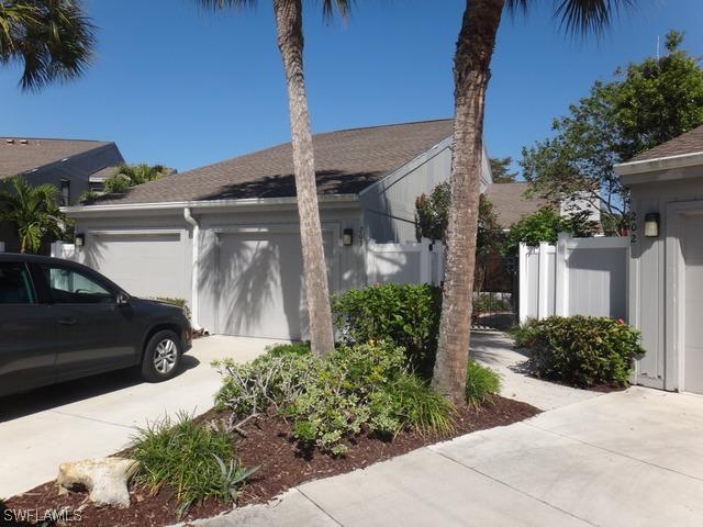 203 Woodshire Ln., Naples, FL