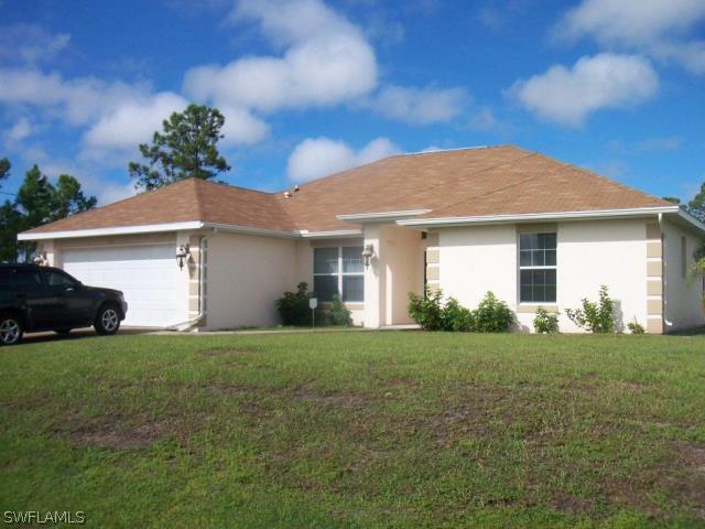 911 Poinsettia Ave., Lehigh Acres, FL 33972