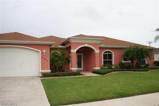 591 Genevieve Dr., Lehigh Acres, FL 33936
