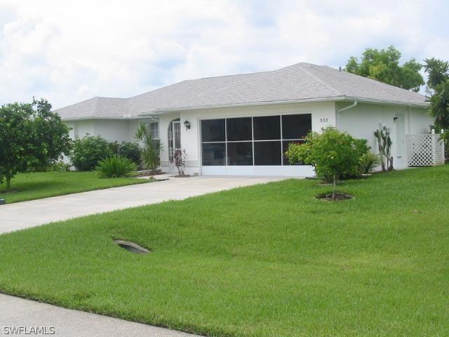 533 Whispering Wind Bend, Lehigh Acres, FL 33974