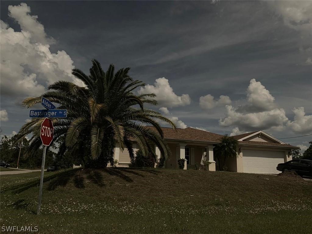1031 Bassinger Ave., Lehigh Acres, FL 33974
