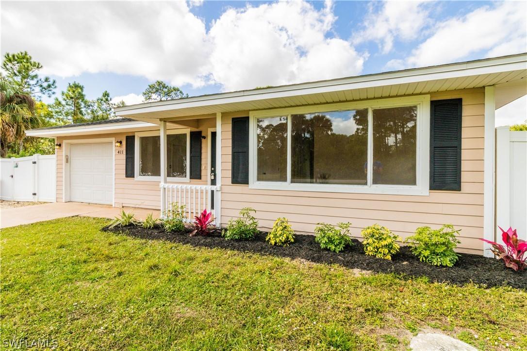 411 Plumosa Ave., Lehigh Acres, FL 33972