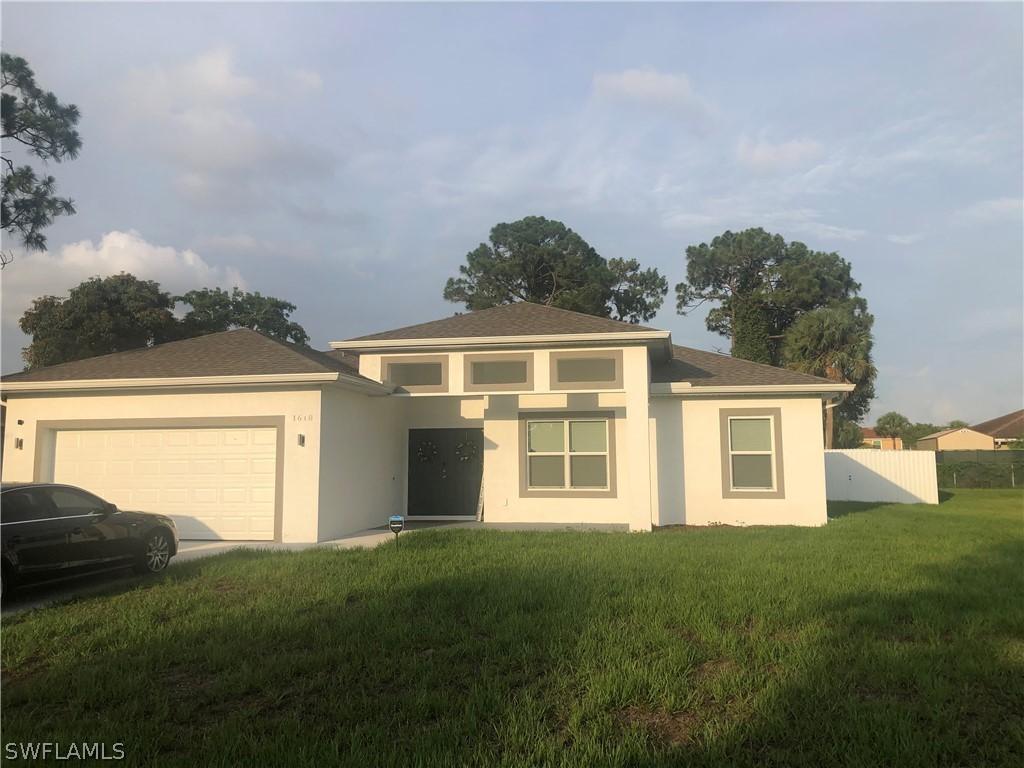 1618 Cheshire Cir., Lehigh Acres, FL 33936