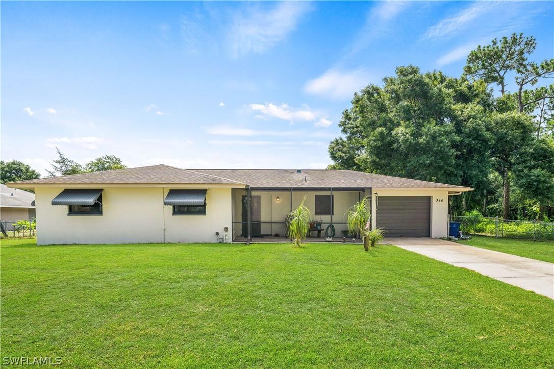 316 Robert Ave., Lehigh Acres, FL 33936