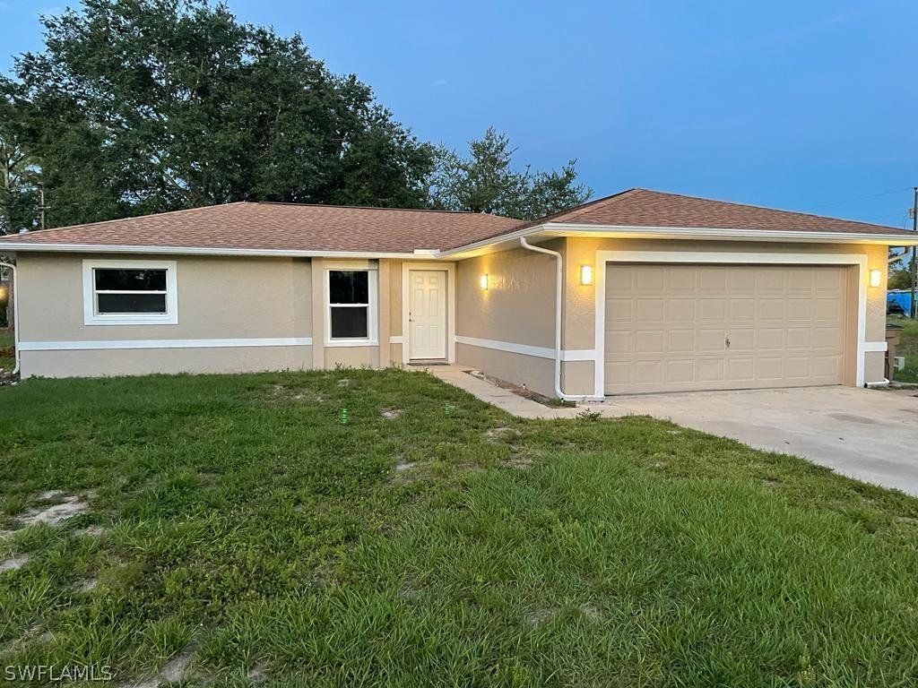 400 Plumosa Ave., Lehigh Acres, FL 33972