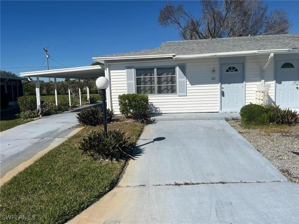 30 Dawn Flower Cir., Lehigh Acres, FL 33936