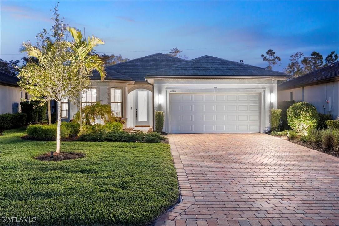 6906 Winding Cypress Dr., Naples, FL 34114