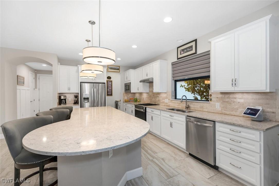 7457 Winding Cypress Dr., Naples, FL 34114