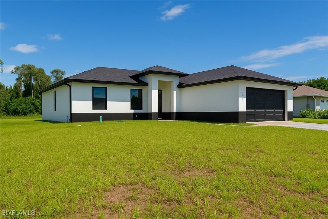 311 Ranier Ave., Lehigh Acres, FL 33974