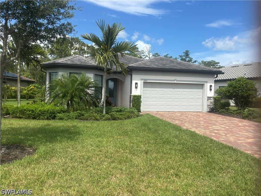 6820 Winding Cypress Dr., Naples, FL 34114