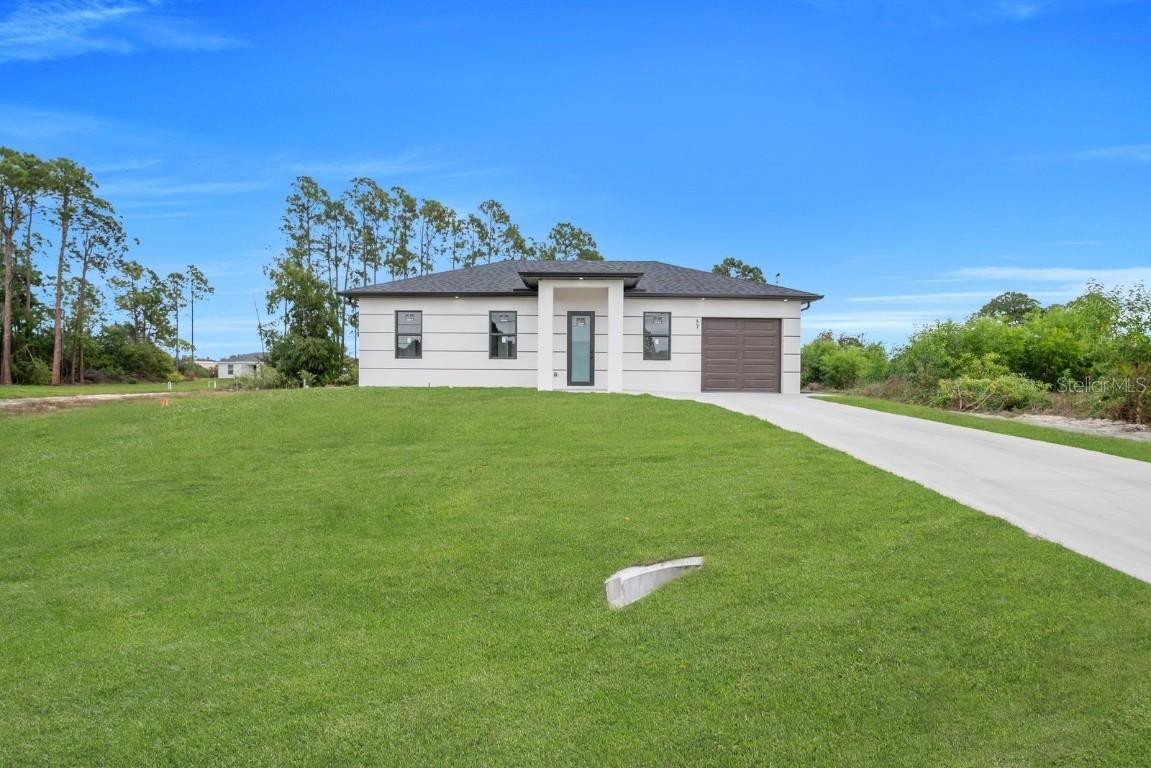 57 Xelda Ave., Lehigh Acres, FL 33976
