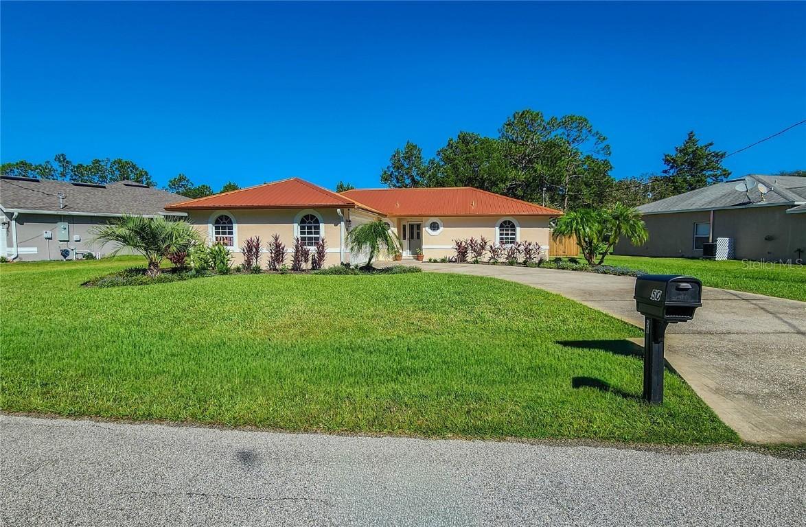 50 Whispering Pine Dr., Palm Coast, FL 32164