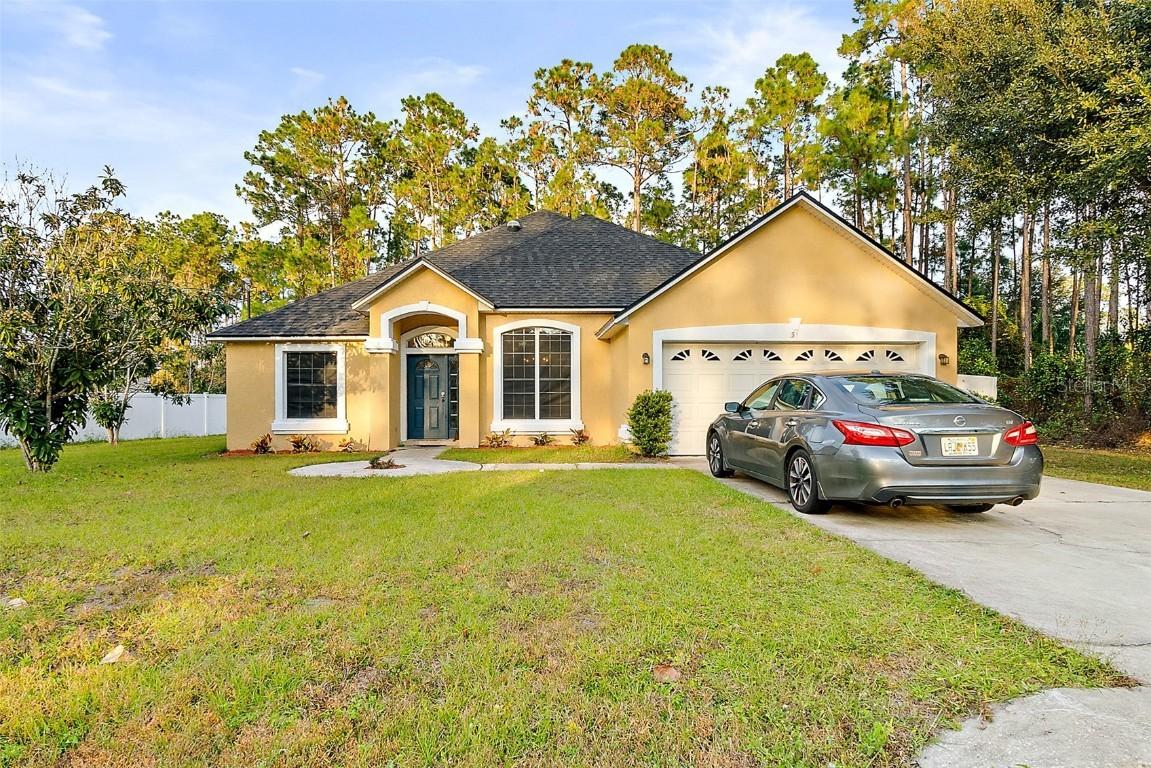 31 Point Of Woods Dr., Palm Coast, FL 32164
