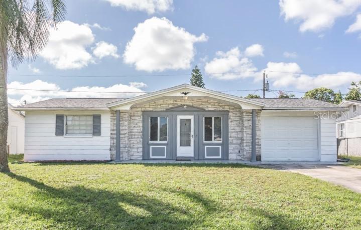 4214 Woodfield Ave., Holiday, FL 34691